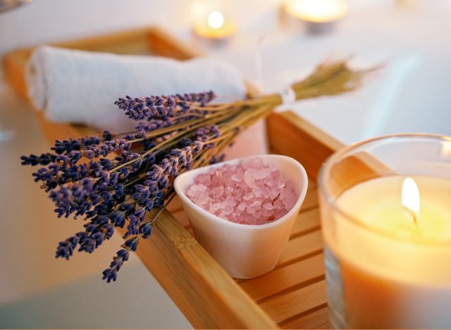 hot bath with lavender bath salts and lit candle