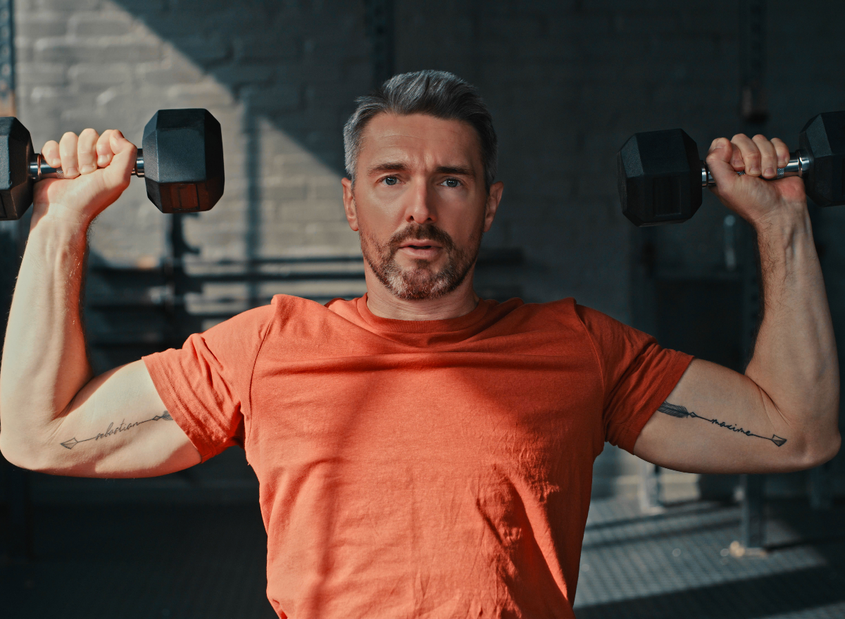man performing dumbbell exercise, visceral fat reducer at 50