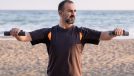 man beach fitness, demonstrating exercises to shrink your belly after 40