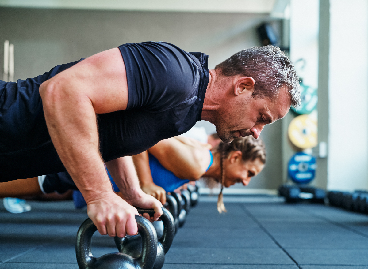 man demonstrating floor exercises to boost your metabolism after 50