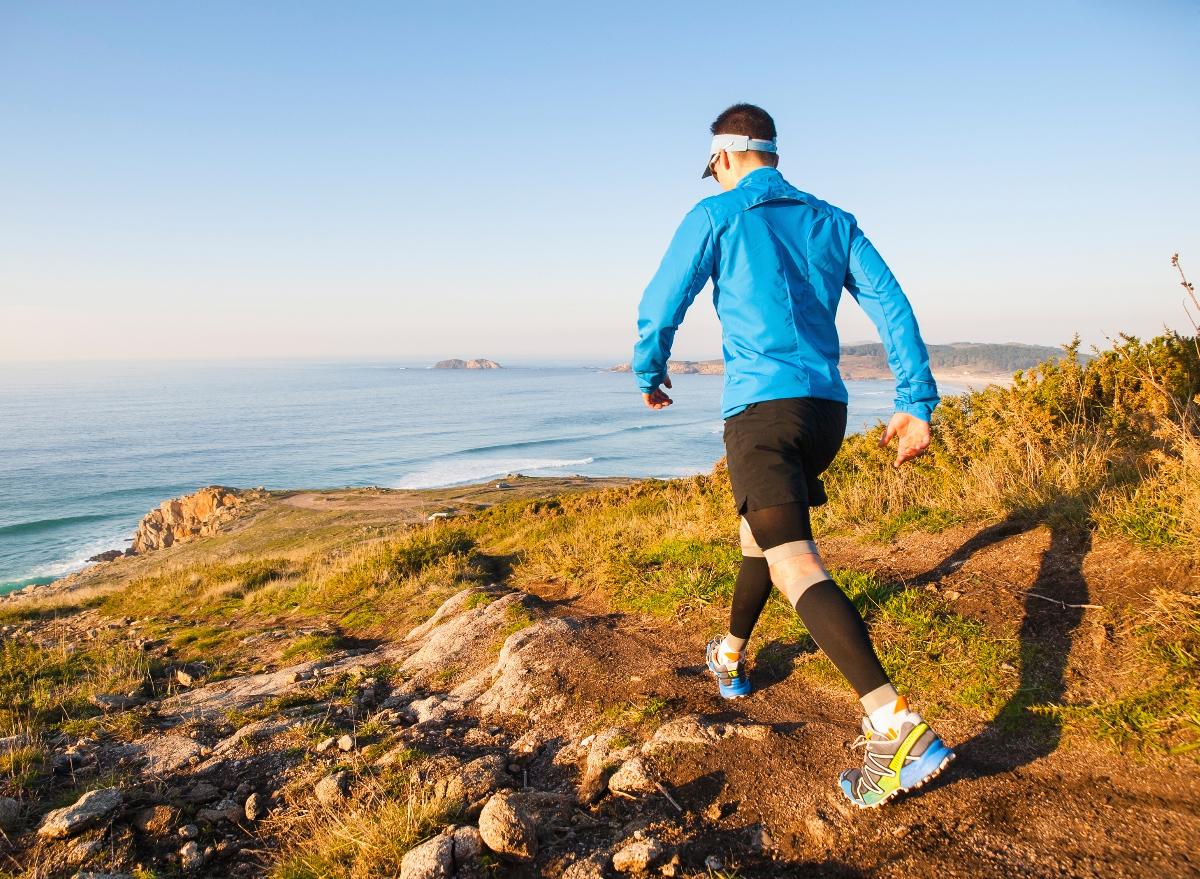 man following trick to walk more each day, scenic backdrop after sunrise