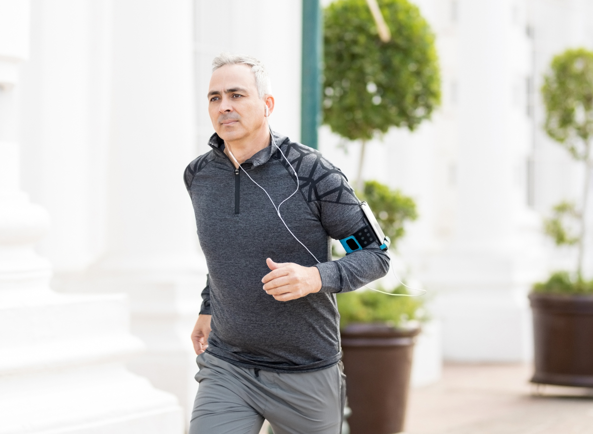mature fit man running, demonstrating not exercising this much can reduce risk of mortality