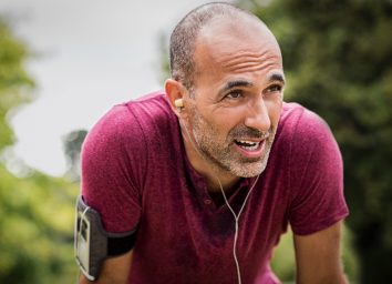 mature man exhausted post-workout, fitness mistakes at 50