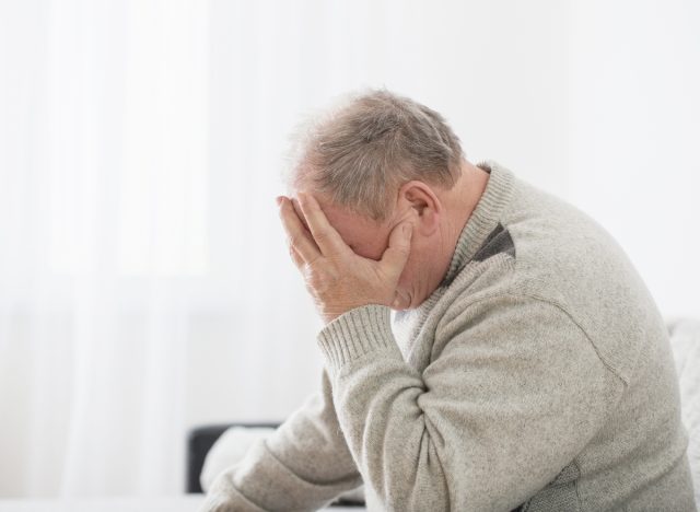 man feeling dizzy with headache, representing how to recognize signs of stroke