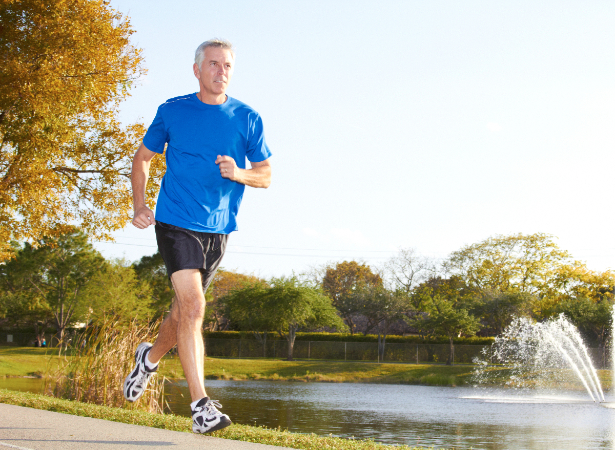 mature man running outdoors, demonstrating the exercise habits that slow aging