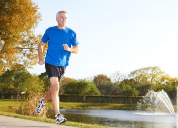 mature man running outdoors, demonstrating the exercise habits that slow aging