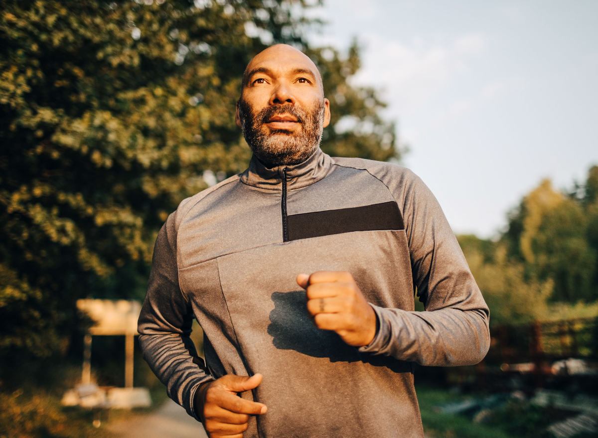 mature man running at sunset, demonstrating workout myths
