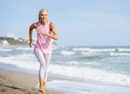 mature woman running on the beach, the exercise habits that slow aging