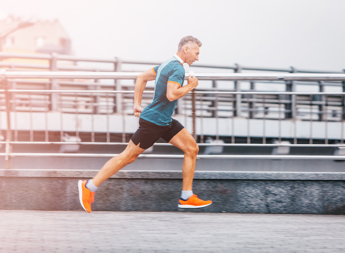 middle-aged man running outdoors, demonstrating the cardio habits that are aging you faster