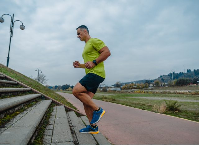 middle-aged man doing stair workout, demonstrating the cardio habits that are aging you faster