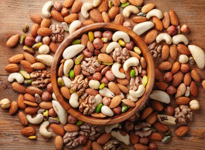 mixed nuts in a wooden bowl