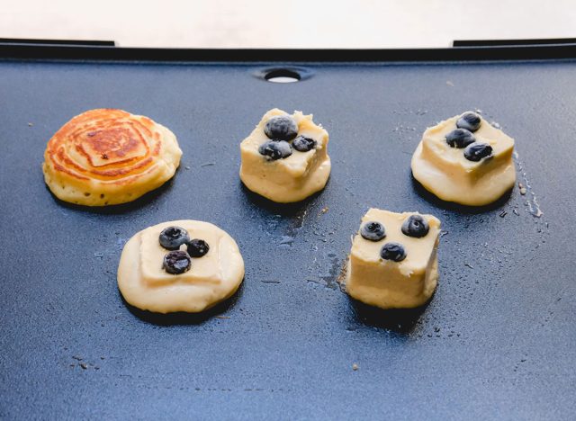 cooking frozen pancake batter on a hot griddle