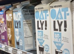 oatly oat milk and silk soy milk at grocery store