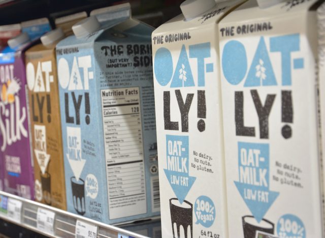 oatly oat milk and silk soy milk at grocery store