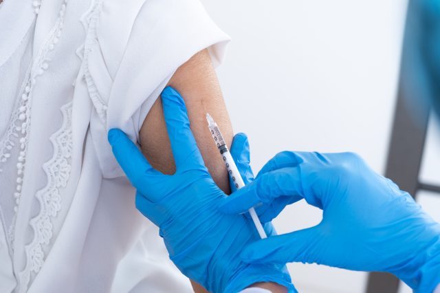 older woman getting shingles vaccine