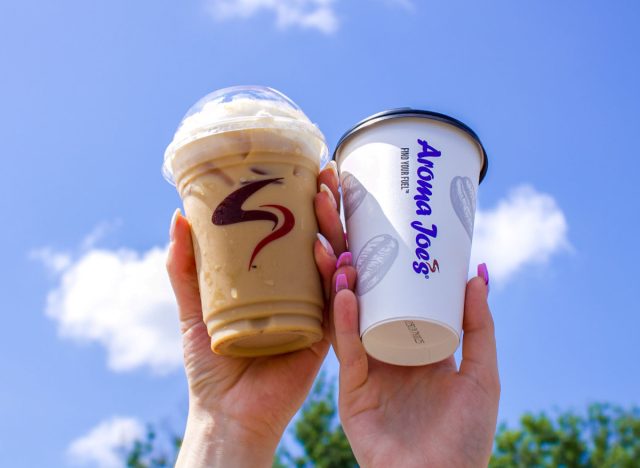 people holding aroma joe's pumpkin lattes