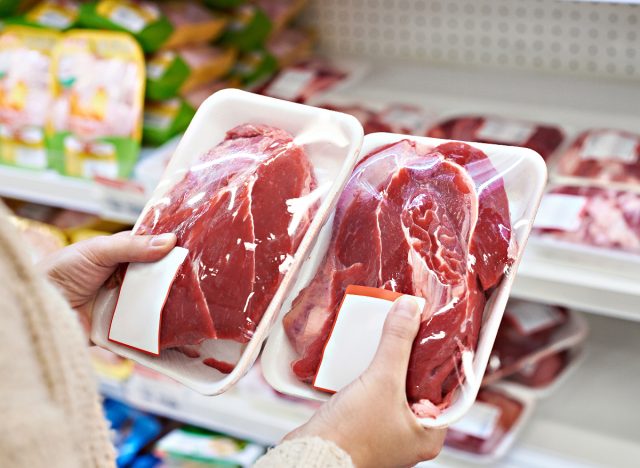 person holding packaged raw meat