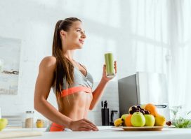 woman drinking green smoothie, one of the best foods for a runner's recovery