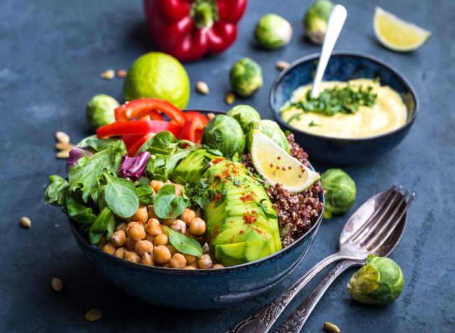 salad with chickpeas, avocado, vegetables, and lime