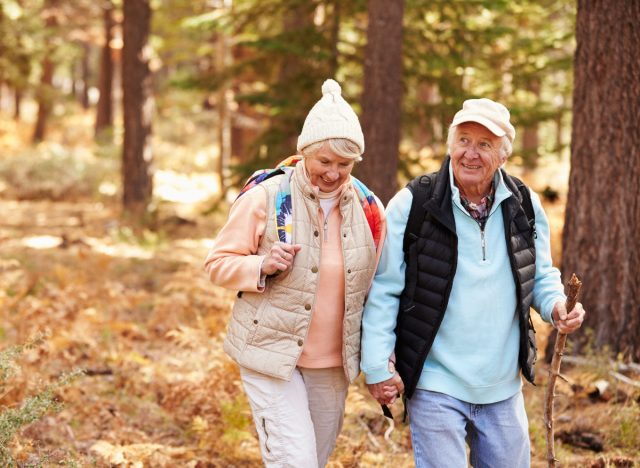 senior couple fall hiking