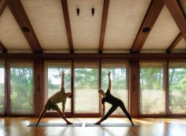 two fit individuals doing yoga session at Sensei Lanai