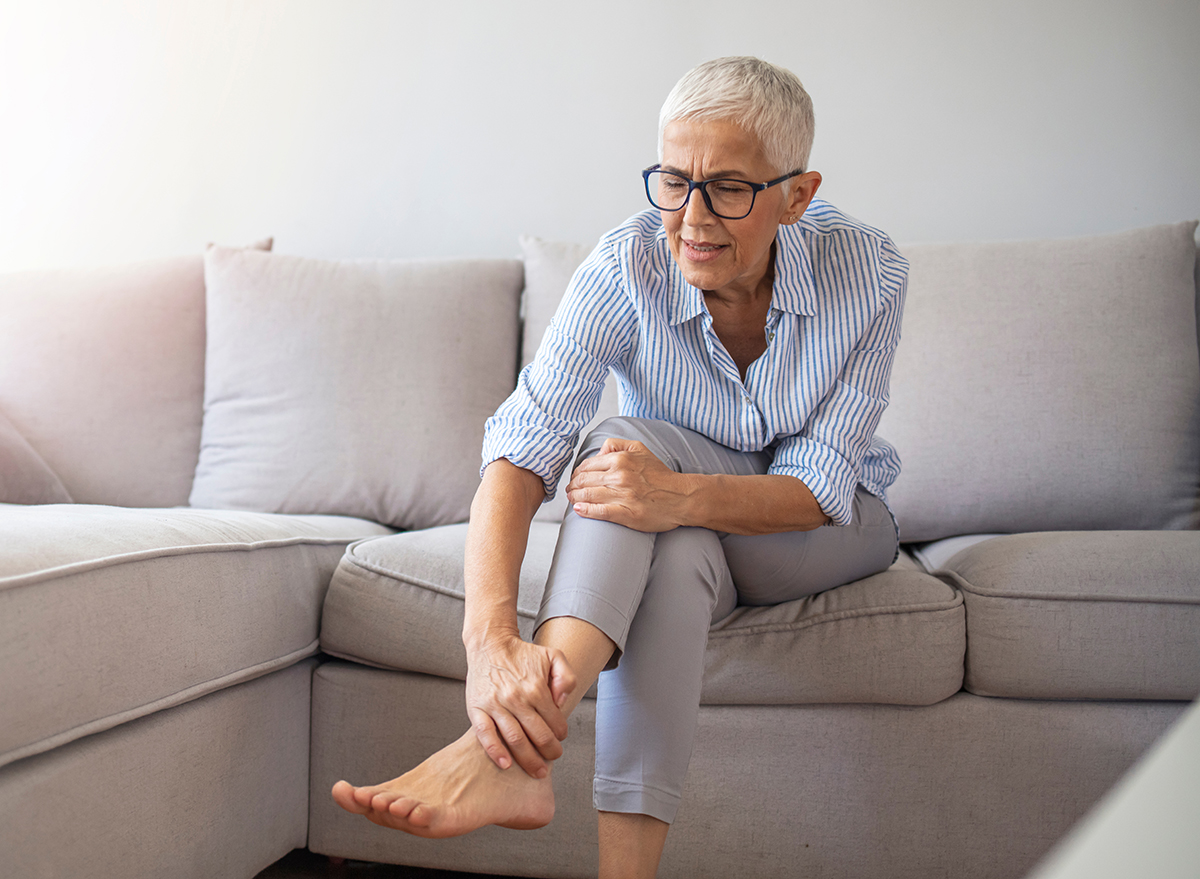 Closeup,Young,Woman,Feeling,Pain,In,Her,Foot,At,Home.