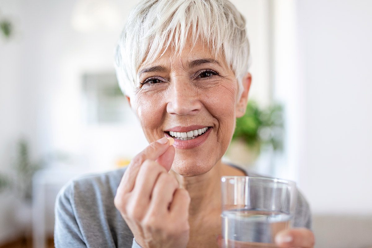 Head,Shot,Portrait,Happy,Woman,Holds,Pill,Glass,Of,Water, vitamins, supplements