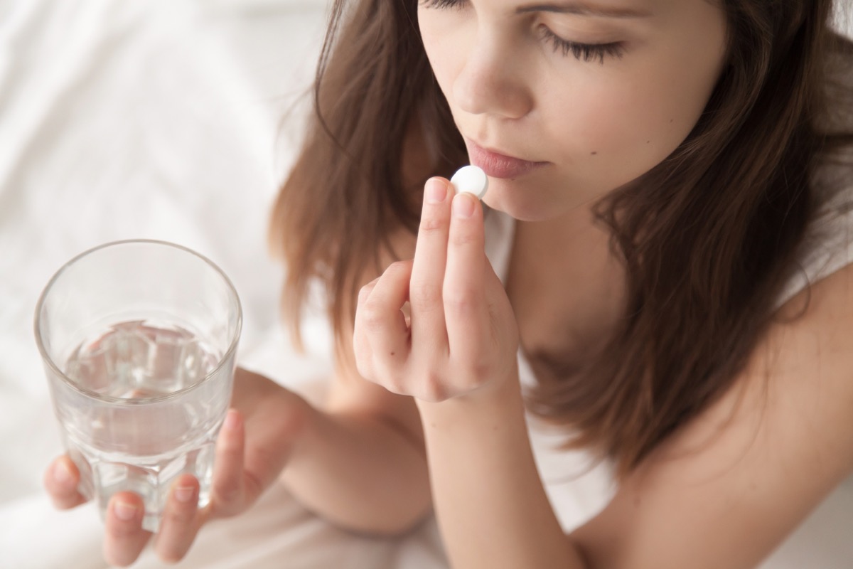 Unhealthy,Sick,Woman,Suffers,From,Insomnia,Or,Headache,,Takes,Sleeping, supplement