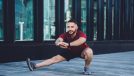 man doing side lunge workout to lose the extra 10 pounds