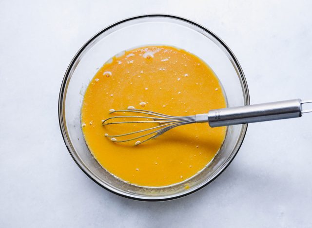 whisking together the wet ingredients for a pumpkin loaf