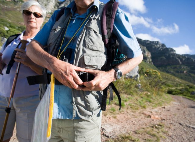 man using weighted backpack as a way to burn more fat while walking