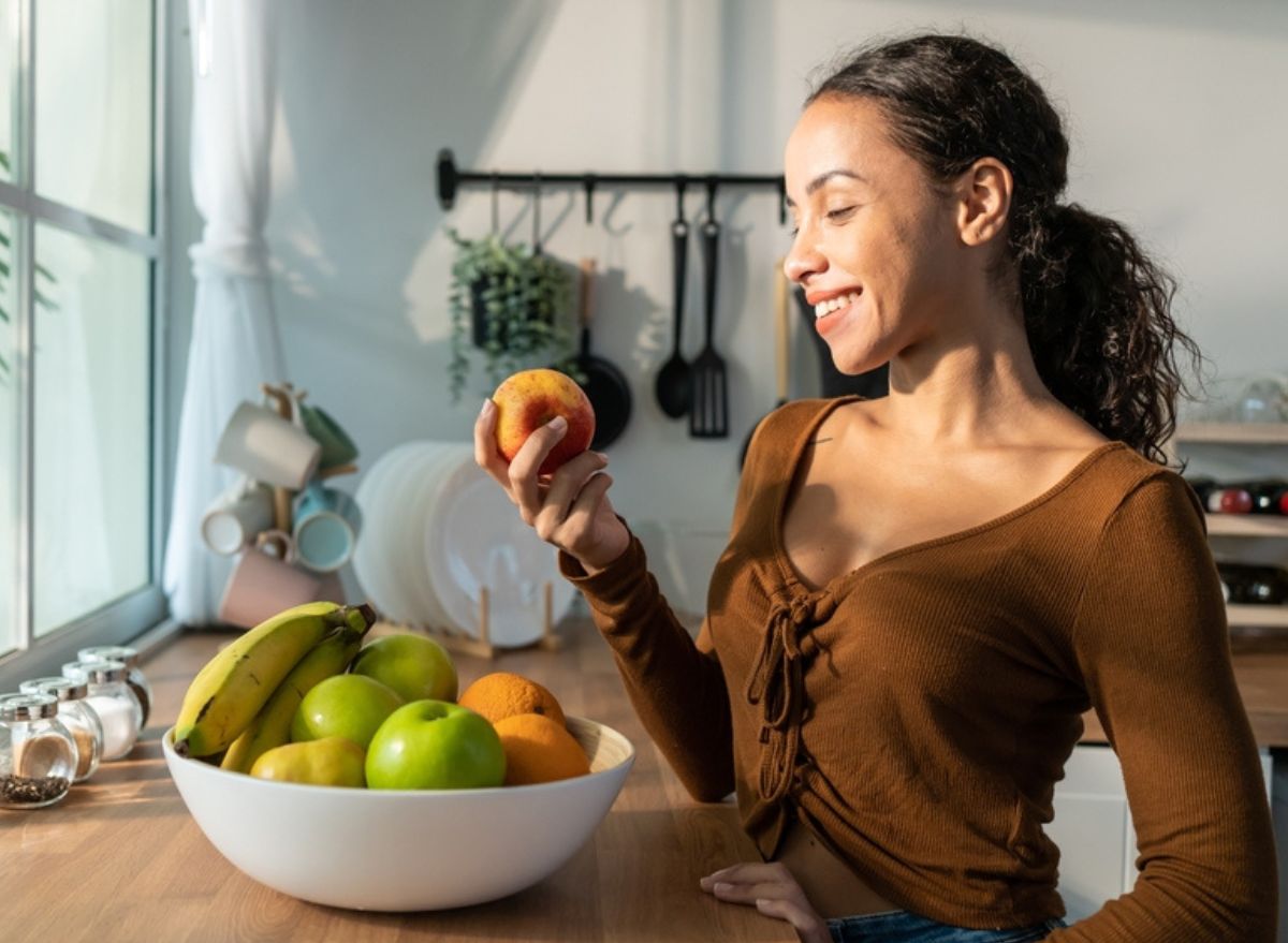 Woman and fruit bowl