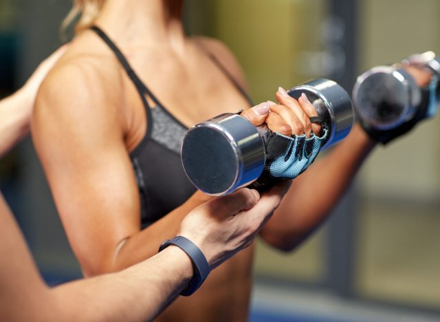 close-up woman performing bicep curl