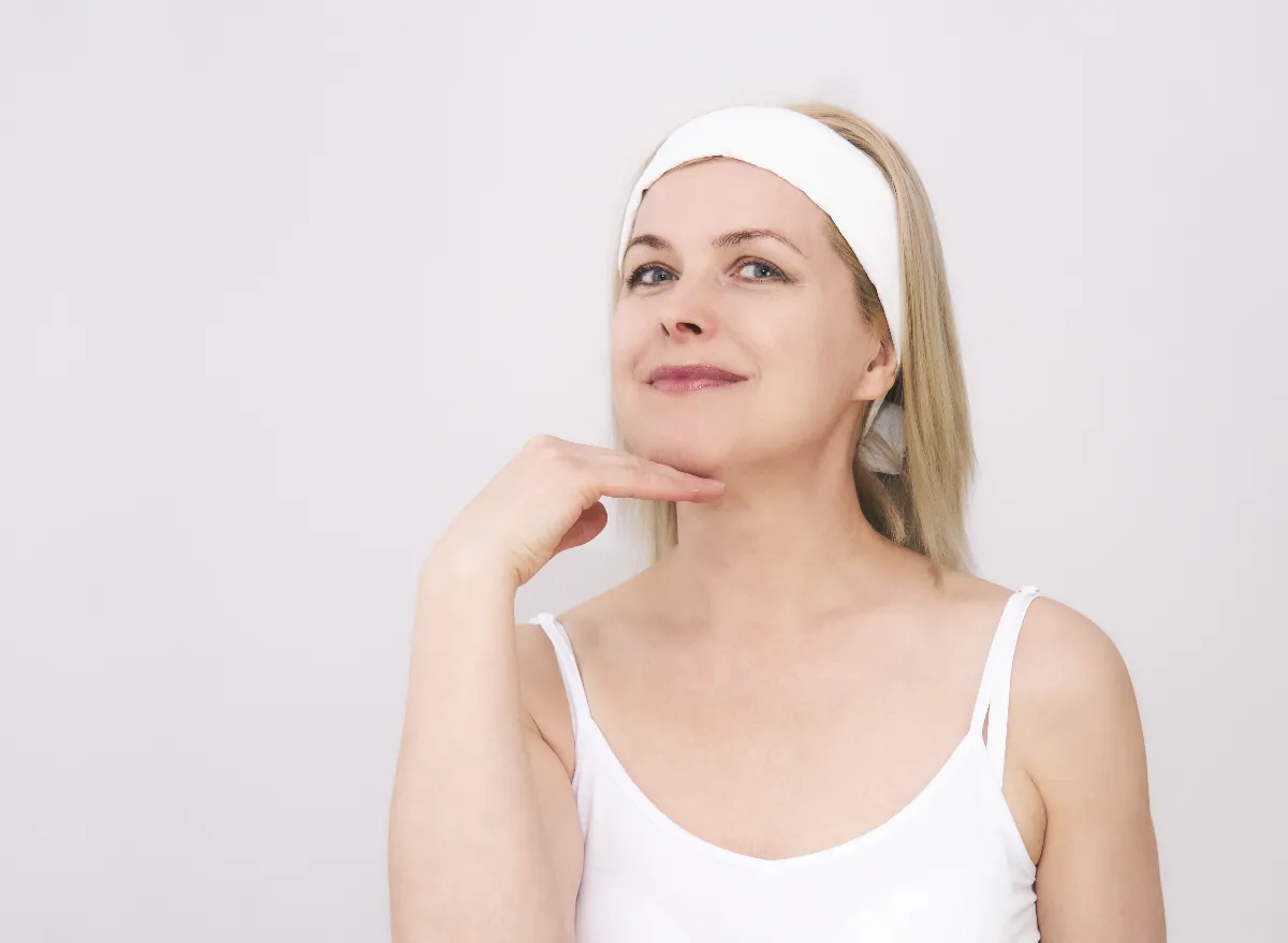 woman doing easy face jowl exercises