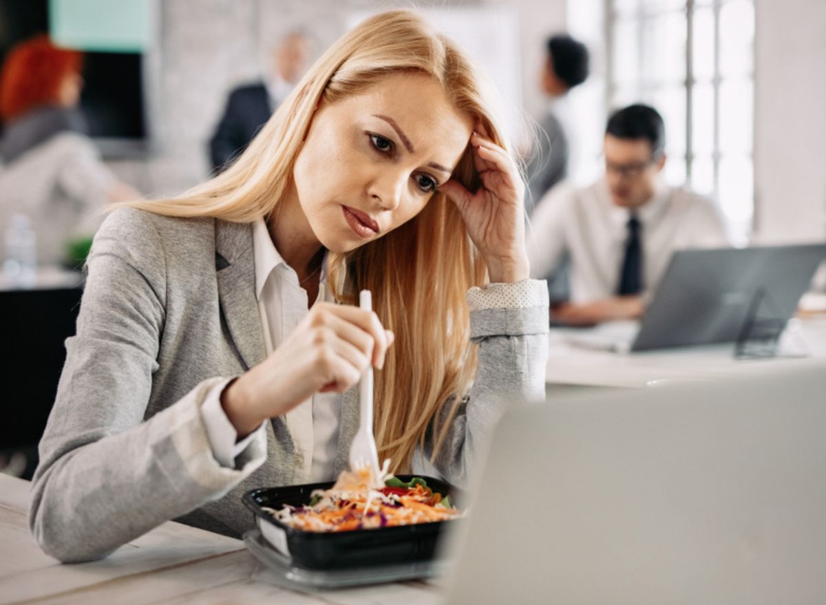 woman eating processed lunch