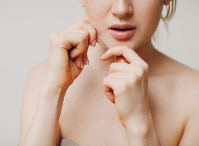 woman demonstrating exercises for sagging jowls