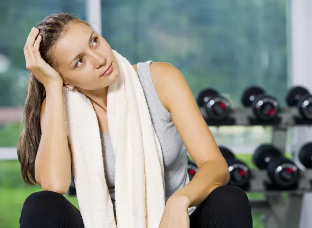 woman thinking in gym