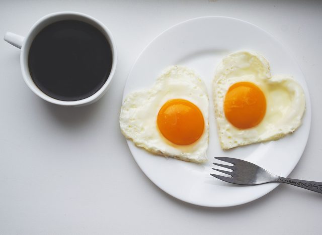 Cup of black coffee and eggs