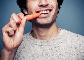 Man eating carrot