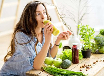 Woman drinking vegetable smoothies