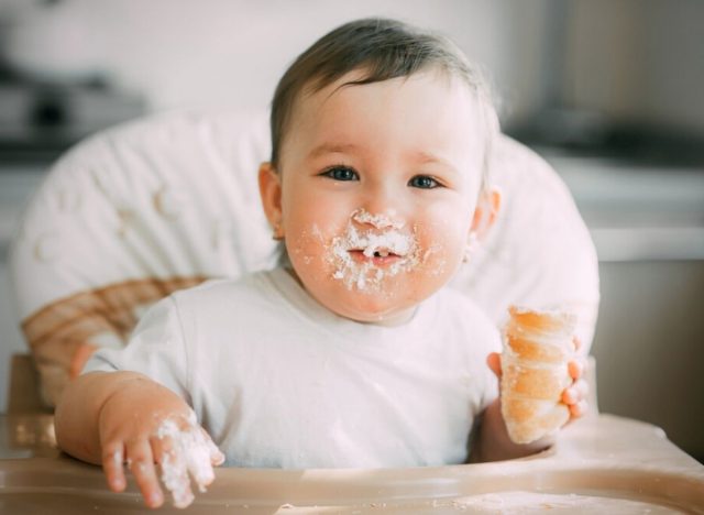 baby eating pastry