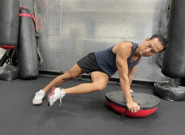 Bosu ball twisting plank exercise part of lower belly pooch workout