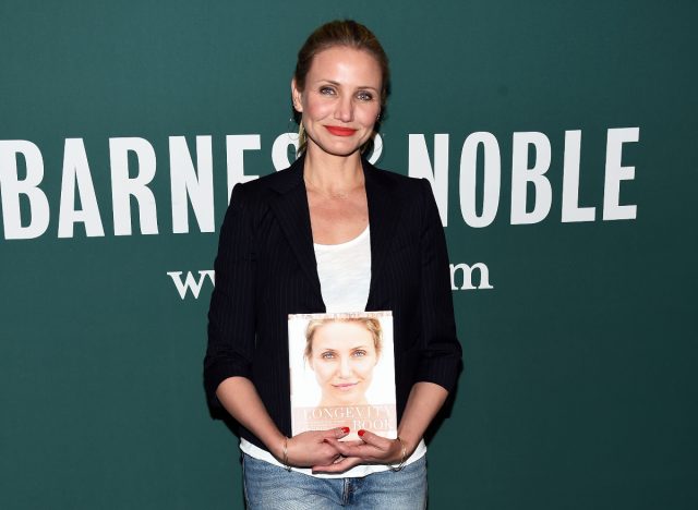 Cameron Diaz holding her Longevity Book