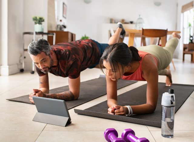 couple demonstrating getting a fitter body after 40 with virtual fitness class