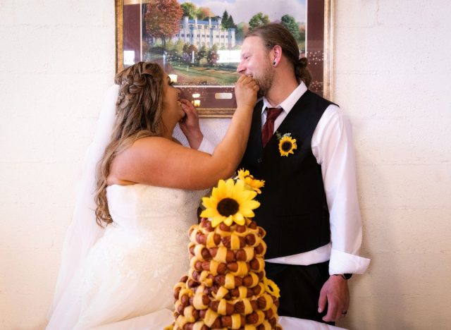 eating cake savory wedding cake