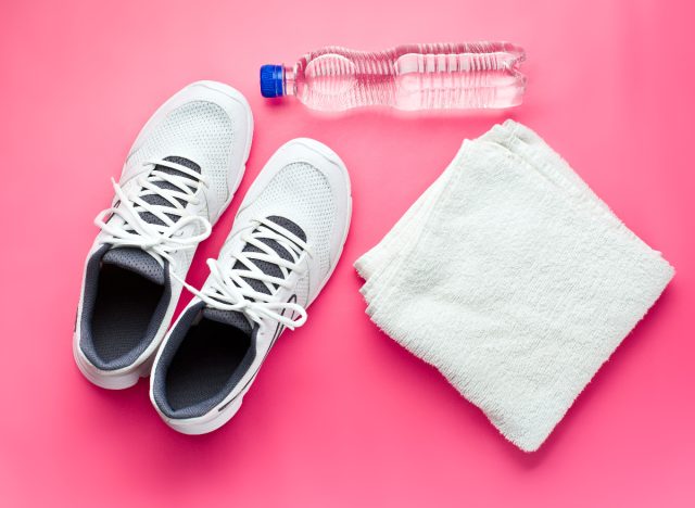 exercise towel, sneakers, and water bottle