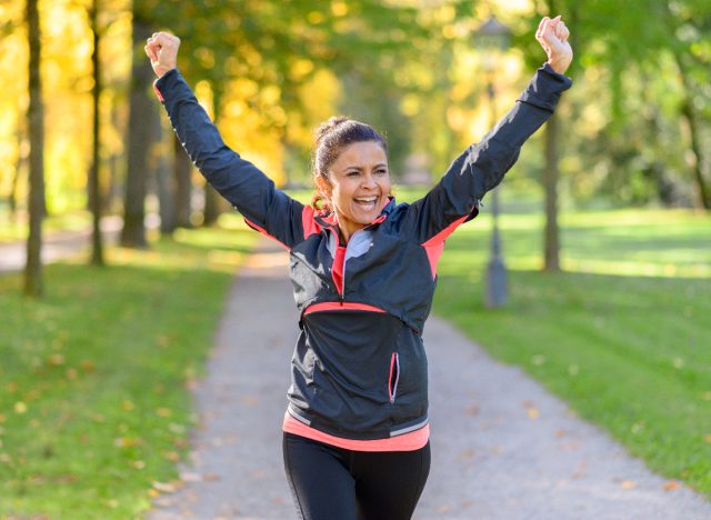 happy woman taking outdoor walk