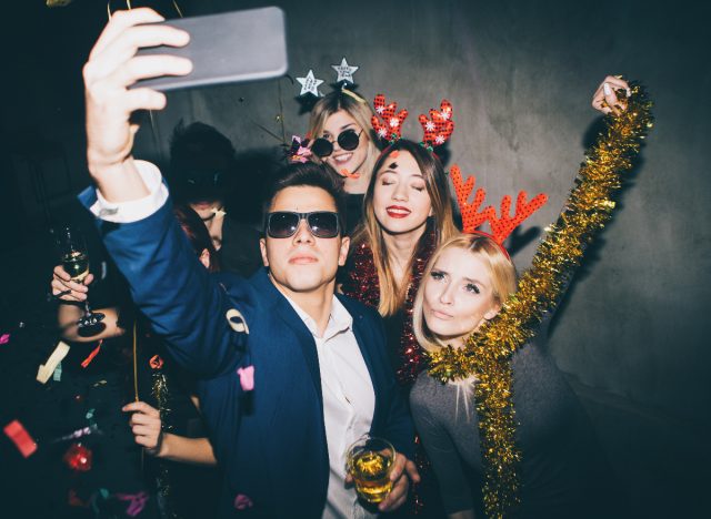 man taking selfie with girl friends