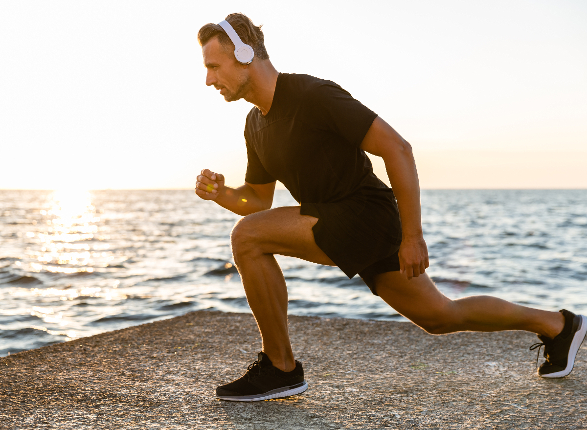 man performing reverse lunges to lose belly fat and slow aging