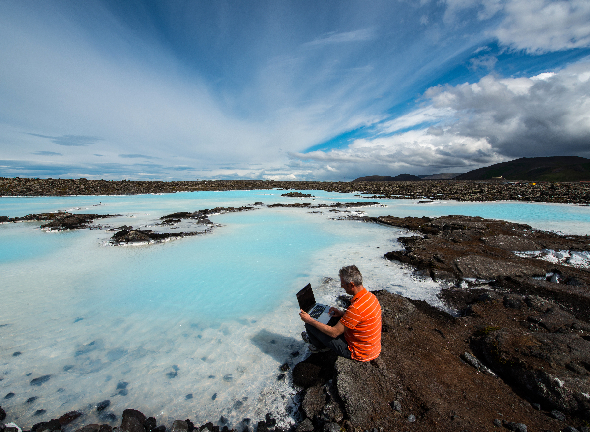 man working by Iceland lagoon